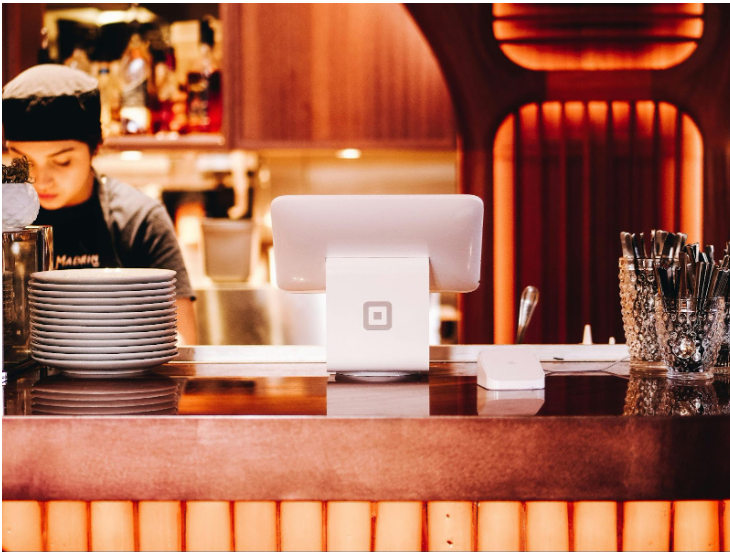 Business team using telecom expense management software dashboard to monitor billing and reduce operational costs.